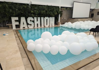 balloons in a pool, fashion parade, Hendra